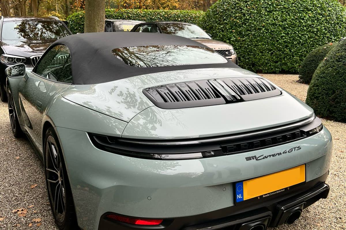 A Porsche 911 photographed from the rear after detailing.